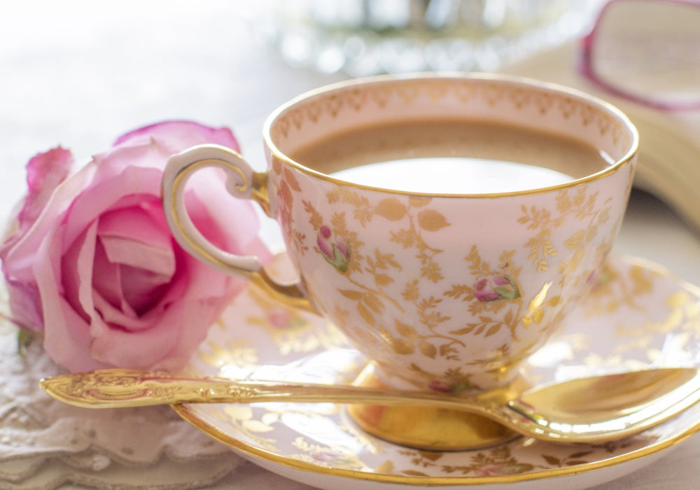 roses and gold tea cup